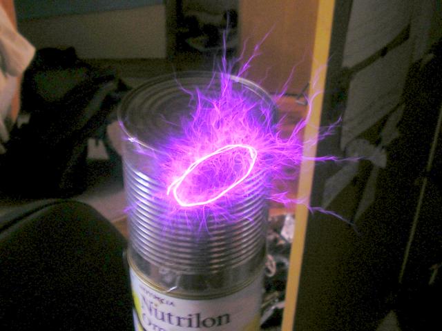 ion pendulum on tesla coil starts to oscillate